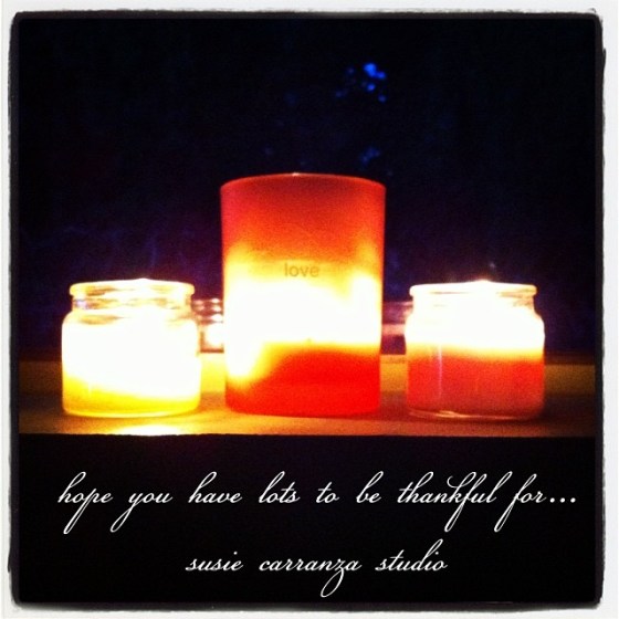 trio of candles on window sill