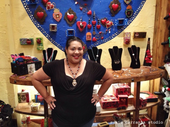 Lizzy Hernandez of Inspira, displaying her jewelry at Hecho con Carino on Olvera Street...