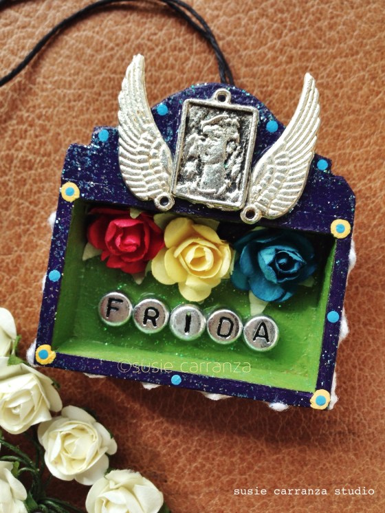 ornament: Frida with wing milagros & flowers...