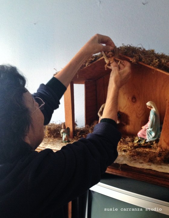 my mom hanging the Gloria angel...