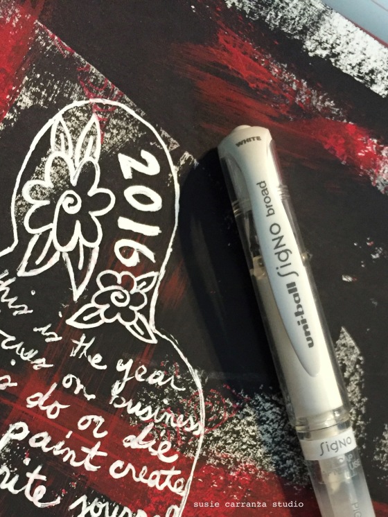 one of my favorite tools: my Signo white ink pen!